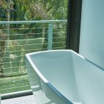 exterior view from bathroom with cable railing juliet balcony made from surface mount posts