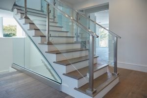 minimalistic glass system with stainless baserail handrail and posts