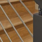 rod railing closeup with black post and universal top